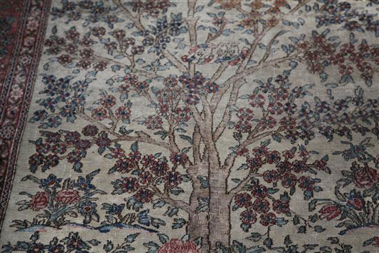 An antique Kerman Tree of Life rug, 6ft 3in by 4ft 4in.